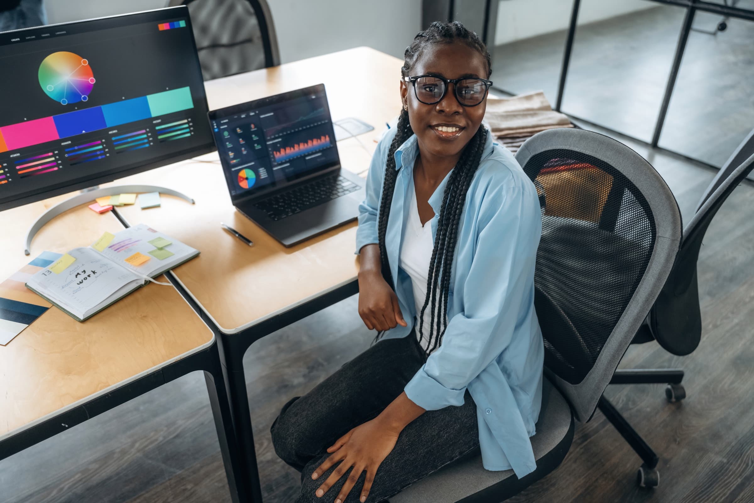 Digital product specialist reviewing interface and analytics work